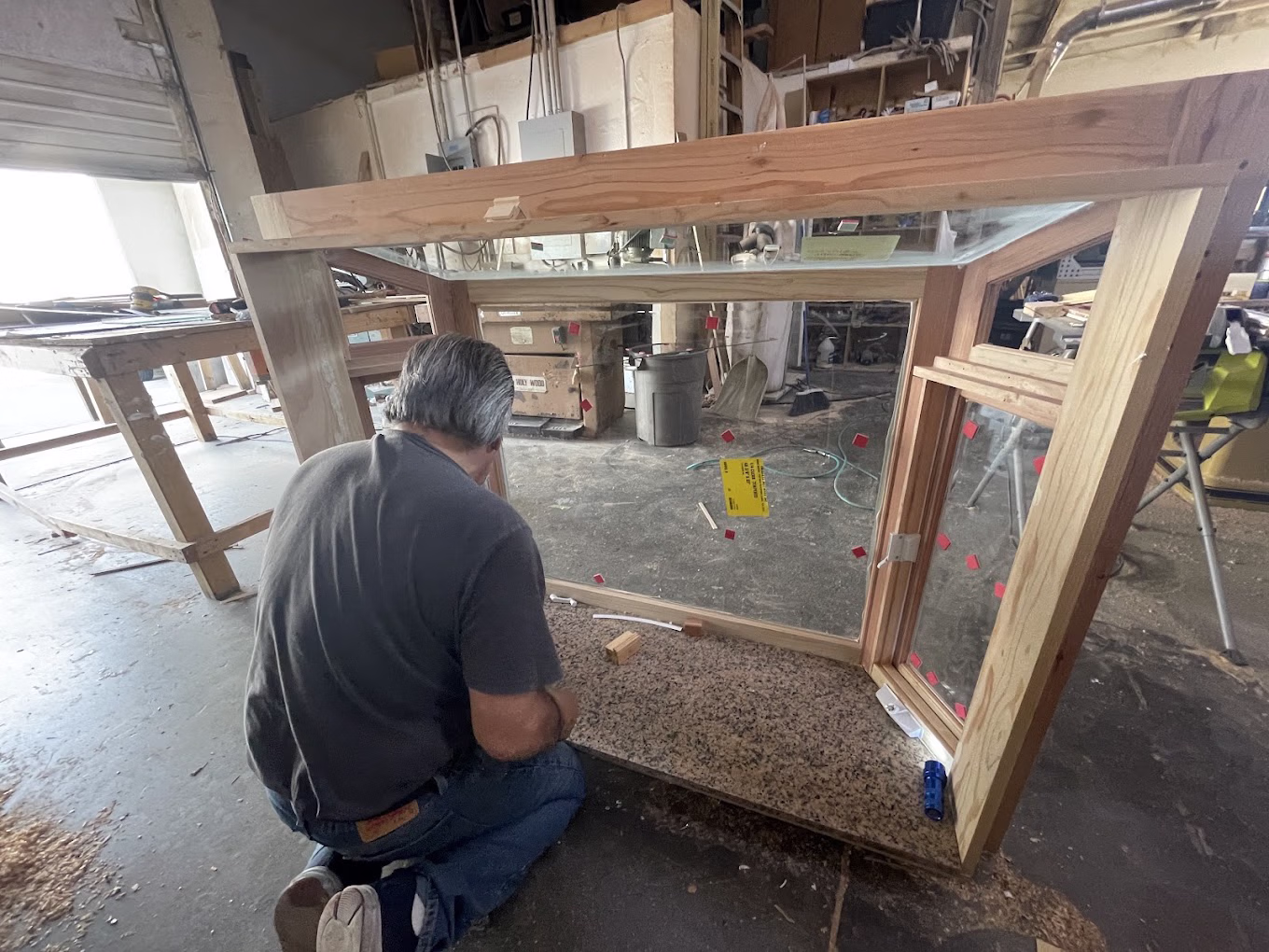 TruCrafter craftsman building a custom wood window in the Los Angeles workshop